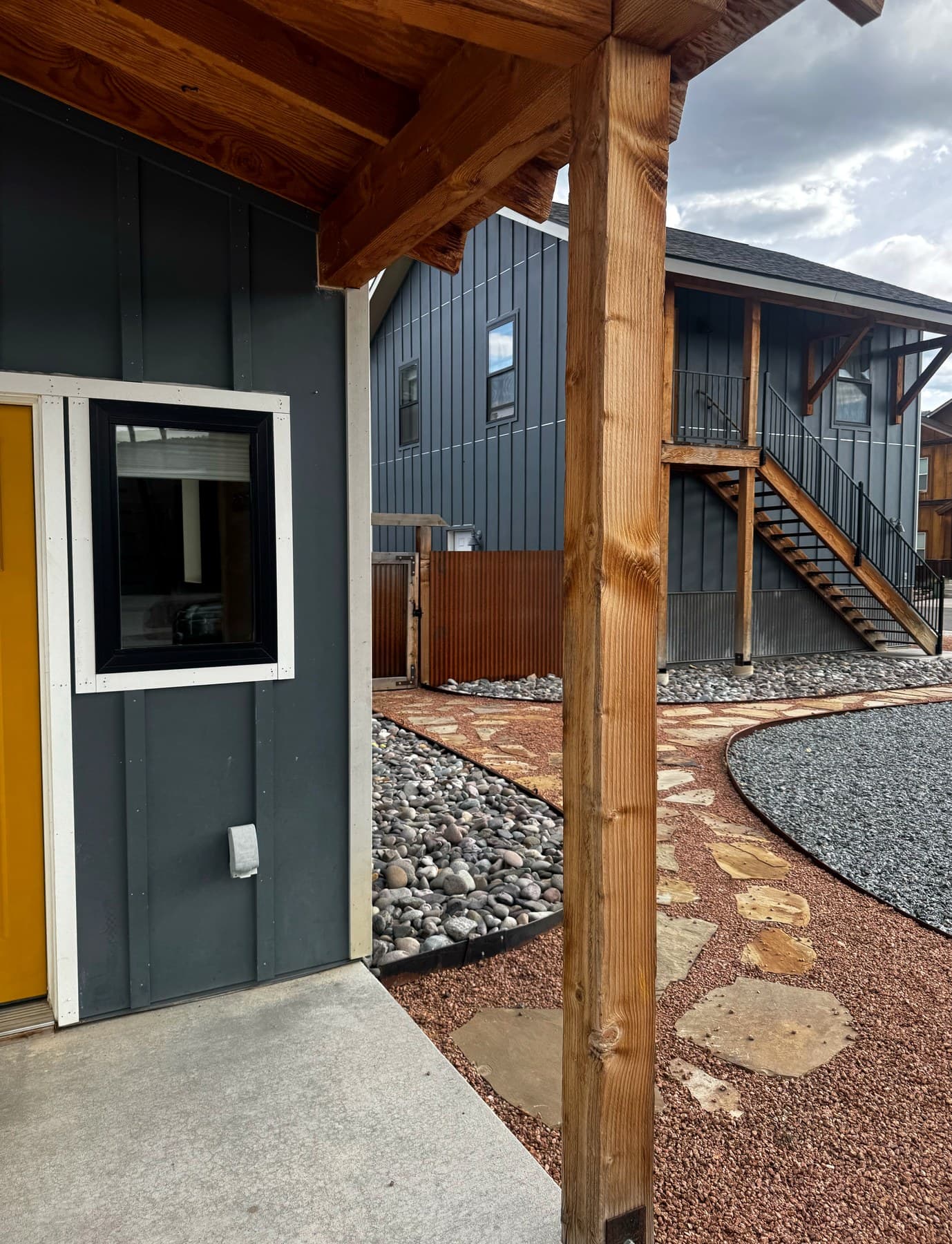 Modern courtyard and dark siding wash